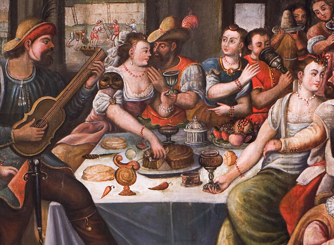 A painting depicting various people eating and drinking around a table .