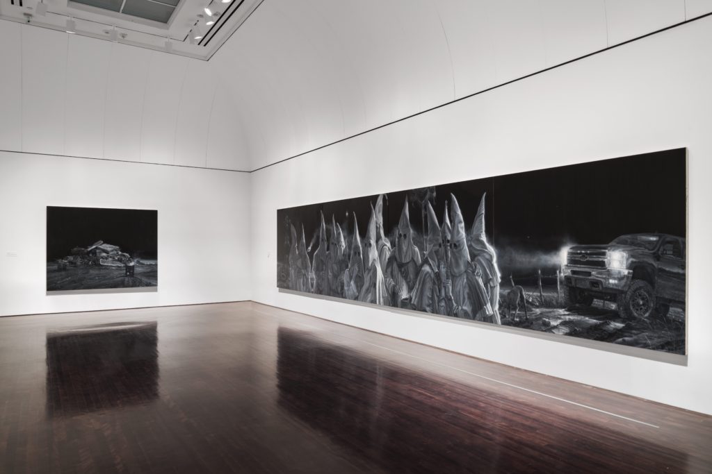 Image of Gallery space with two paintings by Vincent Valdez: The City I, The City II,