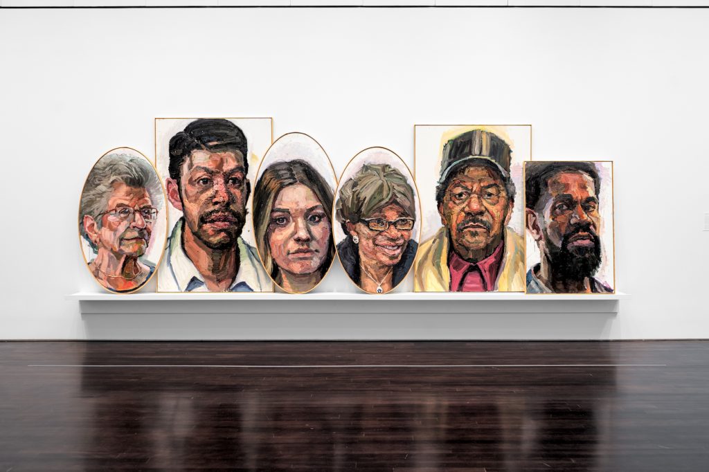 6 painted portraits of different people.