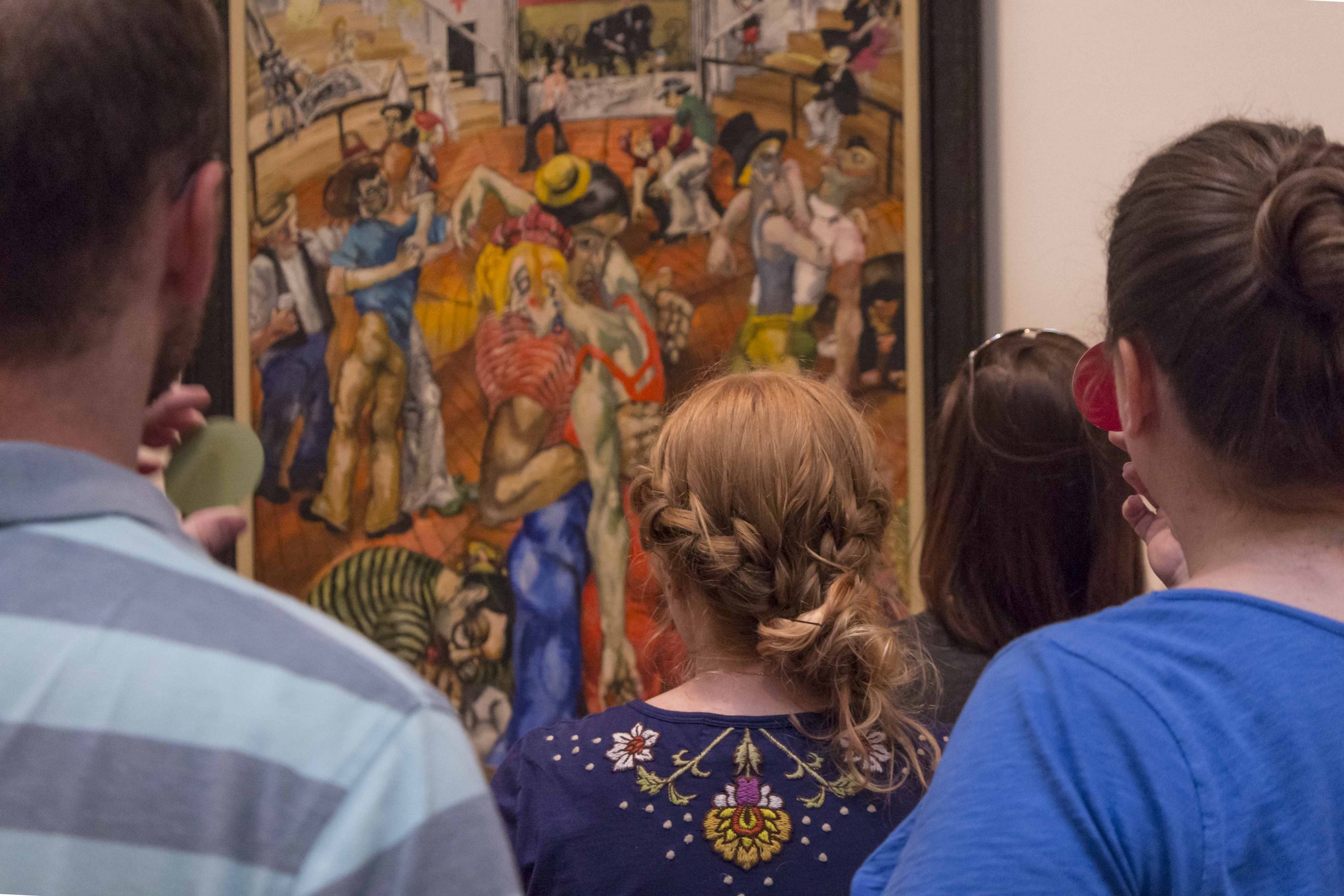 Visitors ponder a painting from the Blanton Museum of Art's collection