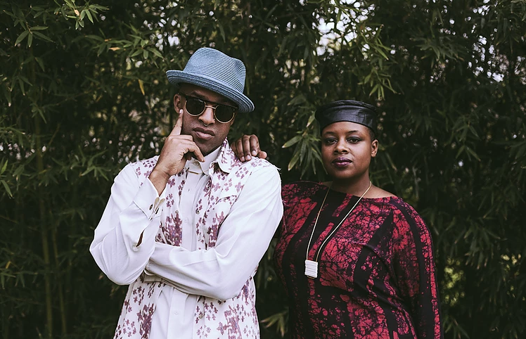 Riders Against the Storm, an Austin-based hip hop duo standing in front of bamboo trees