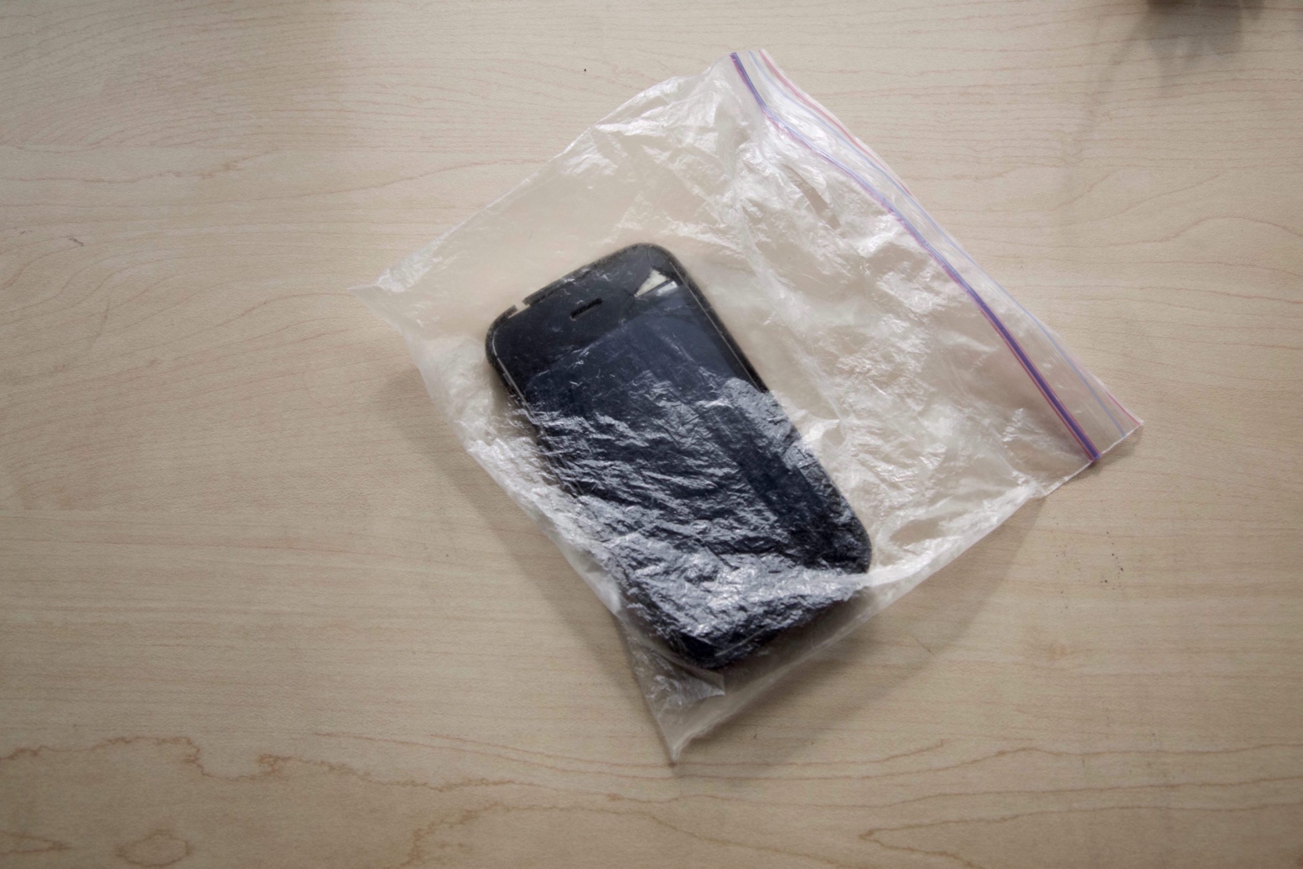 A smartphone in a zipper bag.