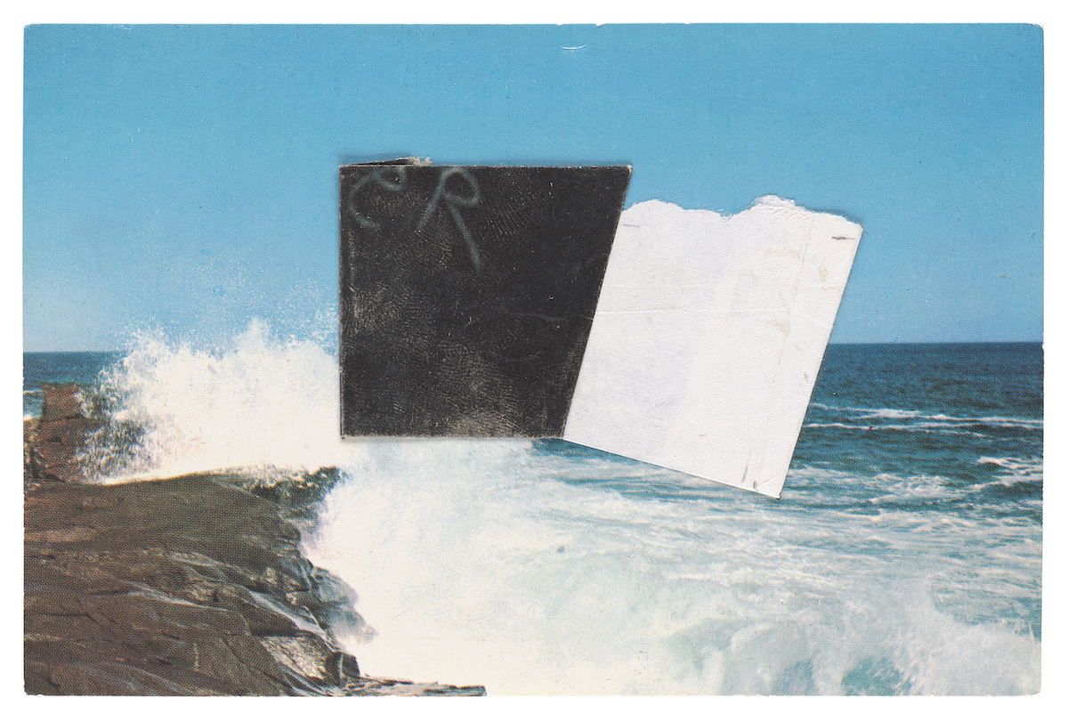 A black and white square placed over a wave crashing on rocks.