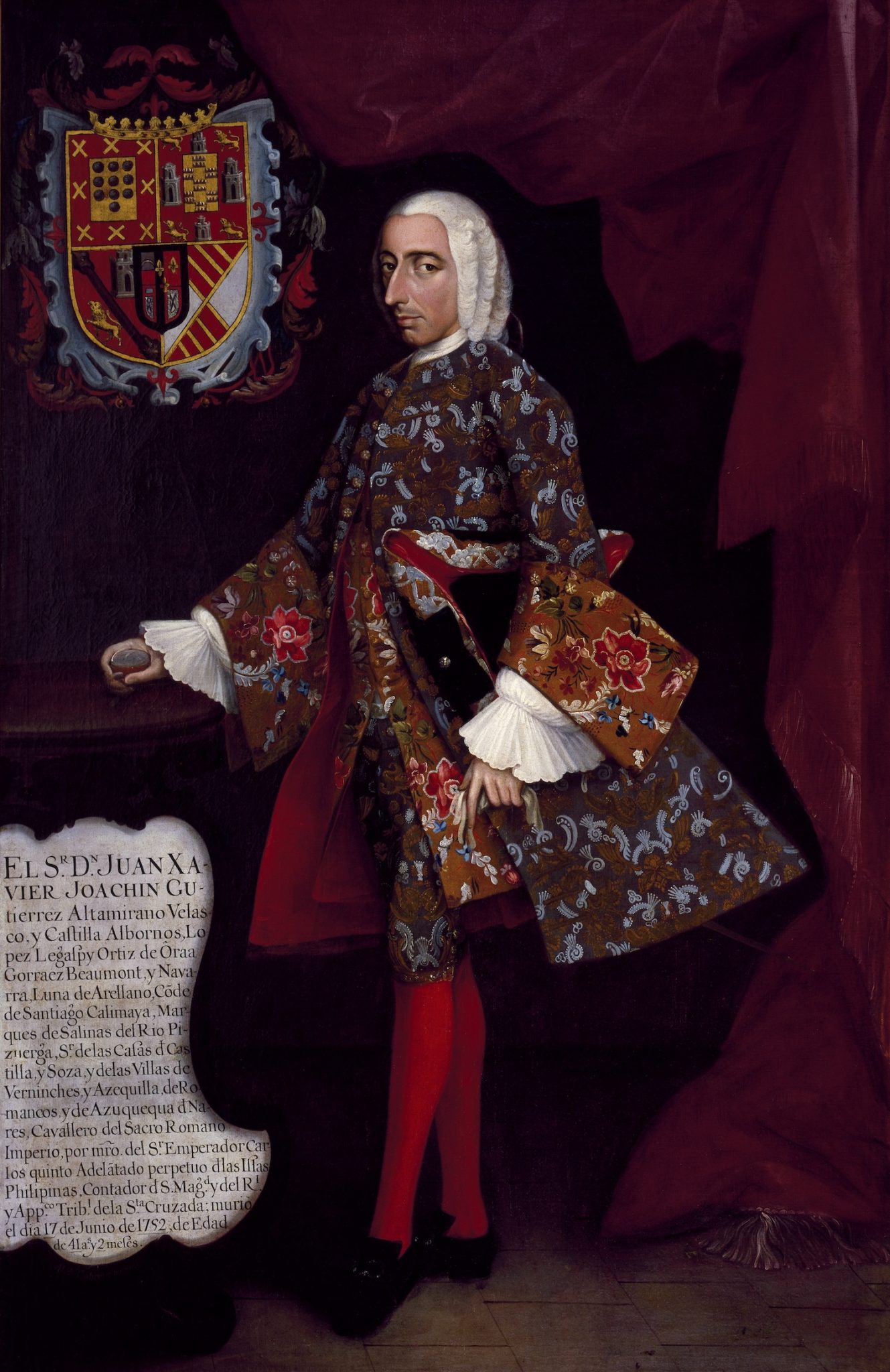 An 18th-century painting of a man wearing a wig and fine clothes, standing in front of a red curtain, with a crest to the left of his head