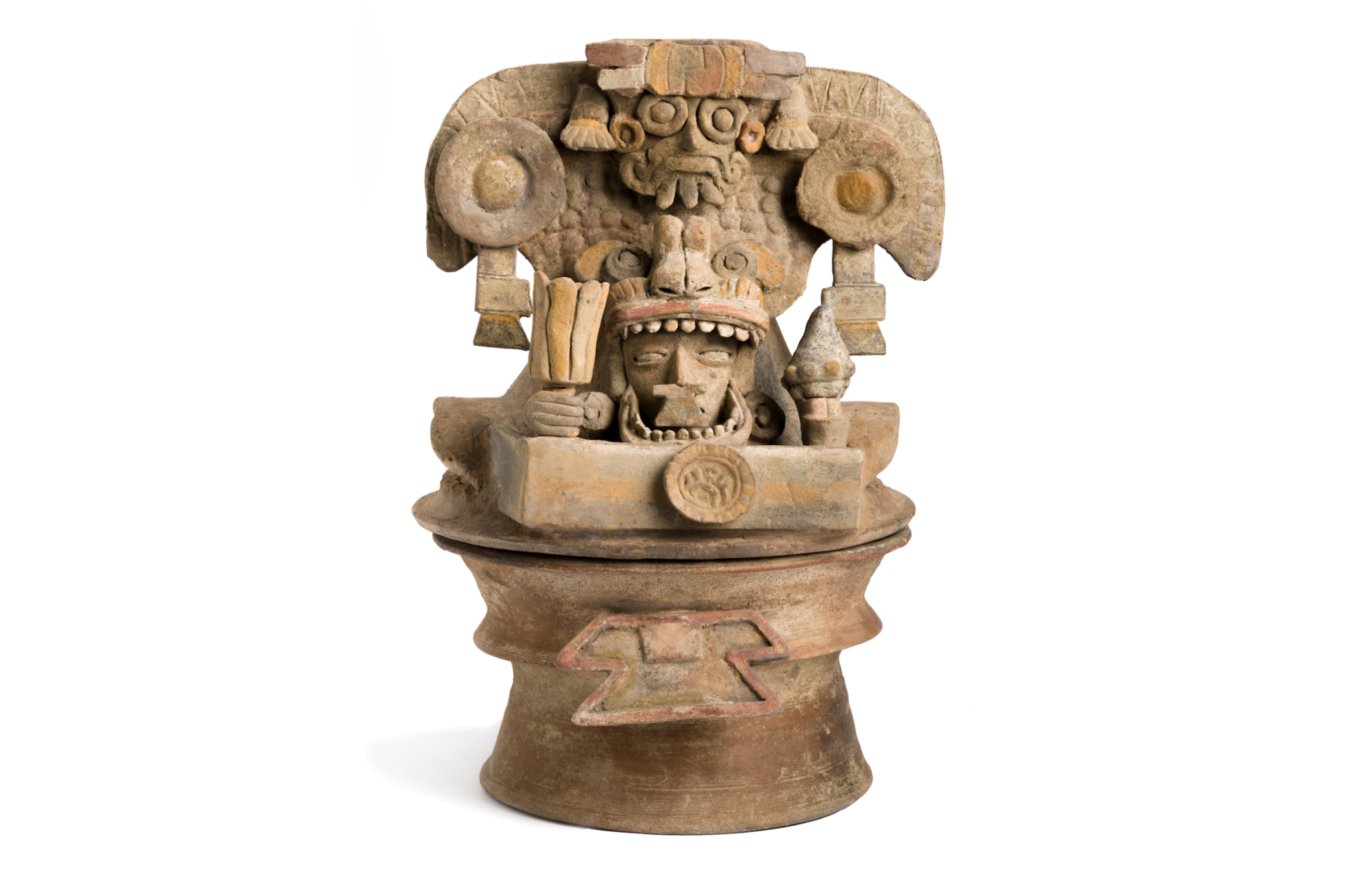 A 300–600 CE sculpture from Maya depicting a person inside a monstrous costumer. The head is positioned in the mouth of the being