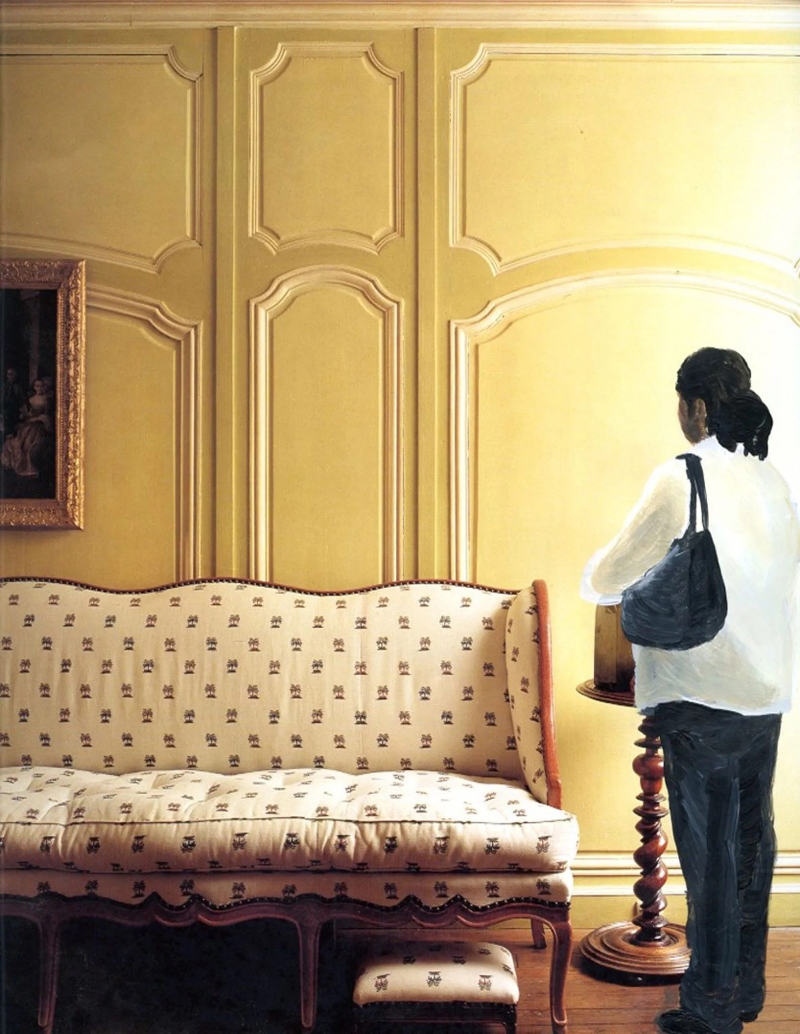 A woman with a black handbag waiting inside a room in a large house next to an ornate couch