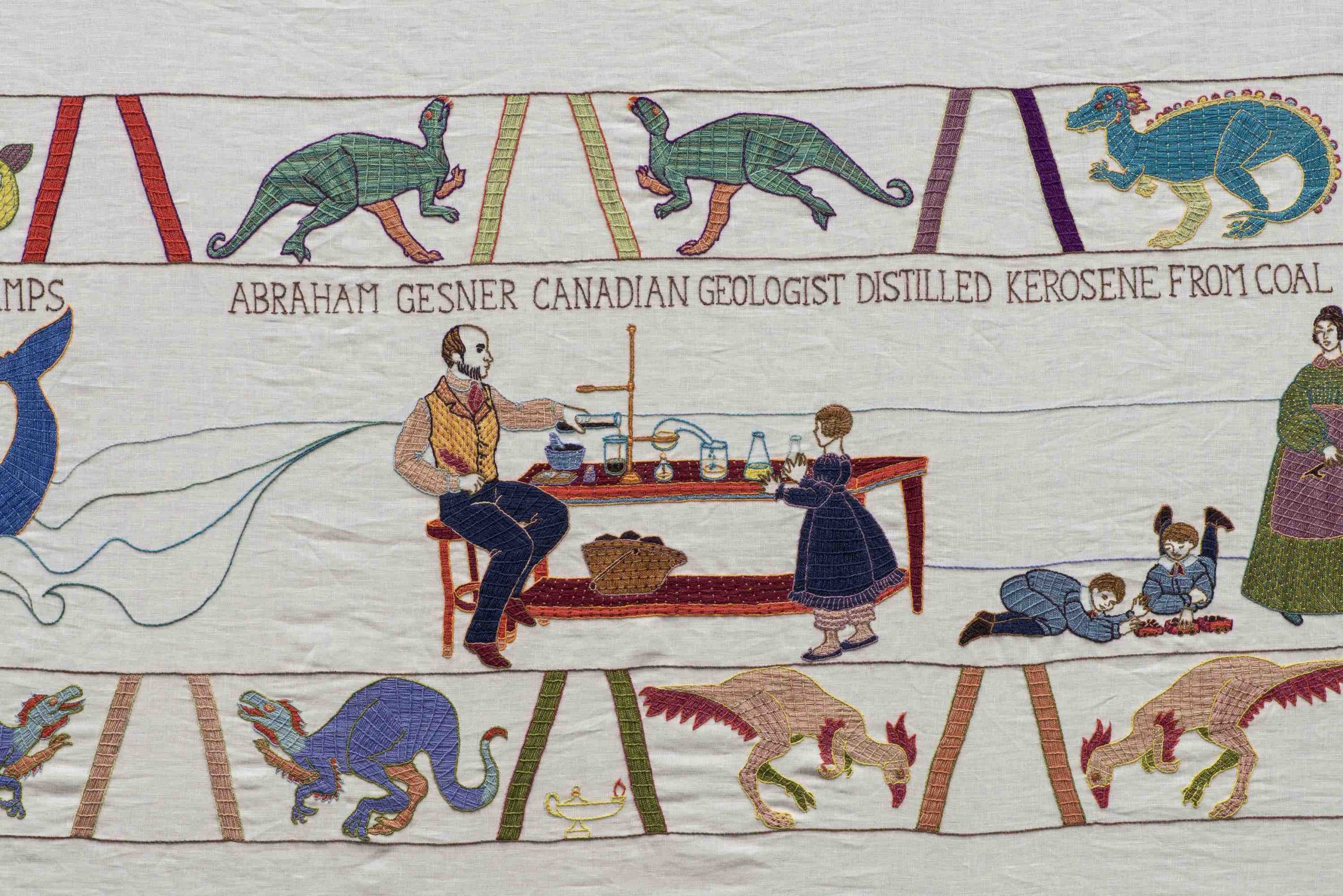 A man sits at a table performing a chemistry experiment as a young girl looks on with the words “Abraham Gesner Canadian Geologist Distilled Kerosene from Coal” written above them