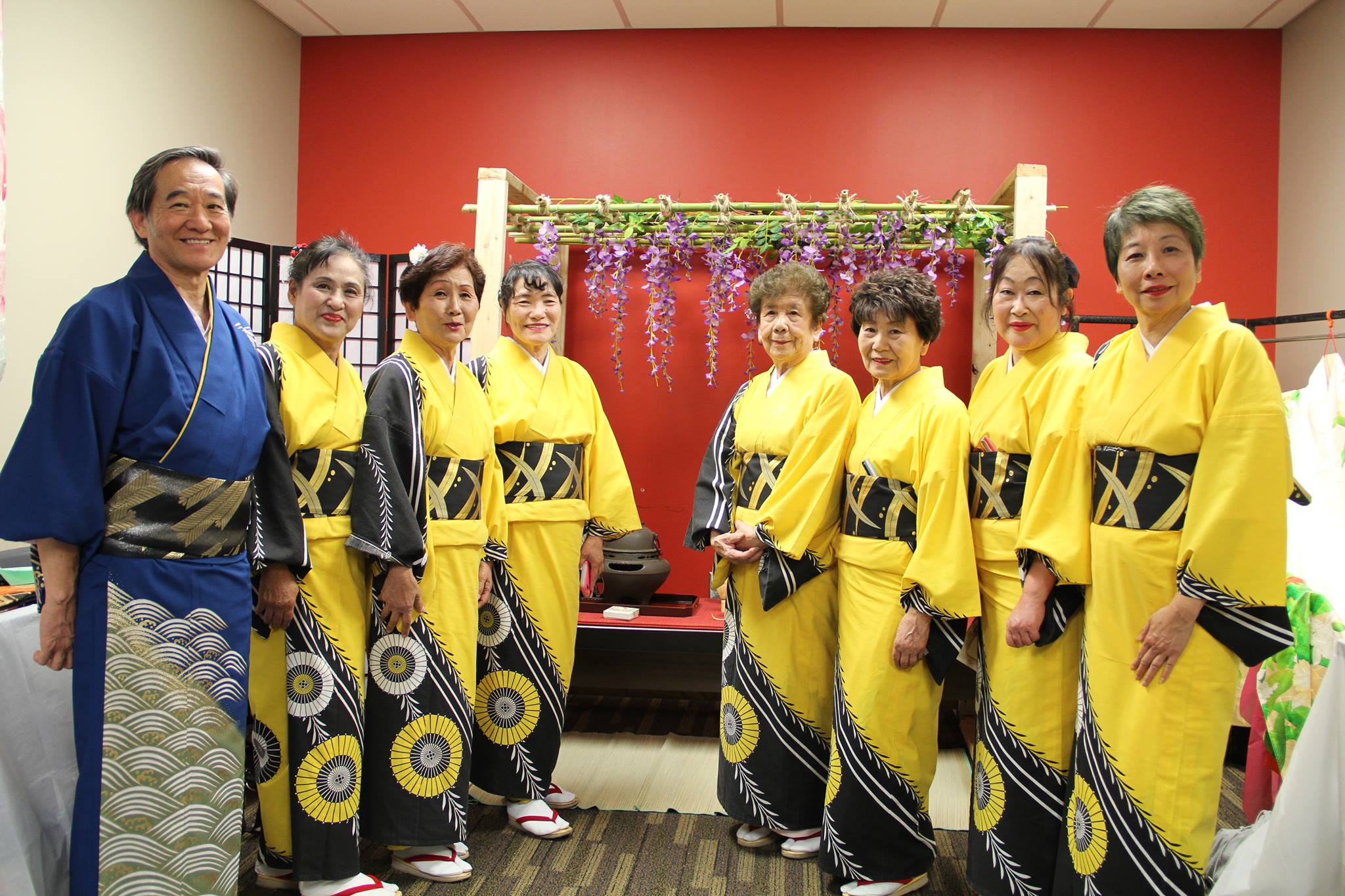 A group of people dressed in traditional Japanese outfits