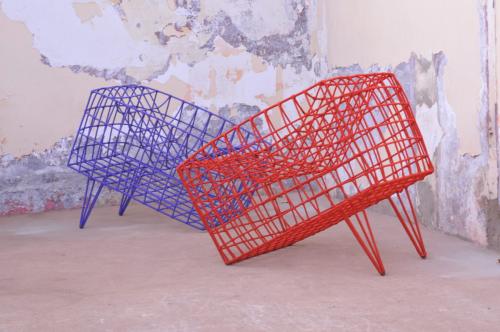 Red and blue chair like sculpture made of metal, nylon and cord