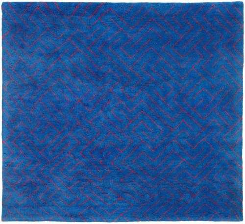 A blue rug with an abstract red design