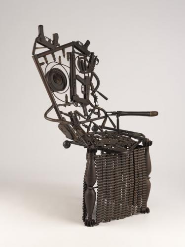 Chair made out of welded weapons and ammunition
