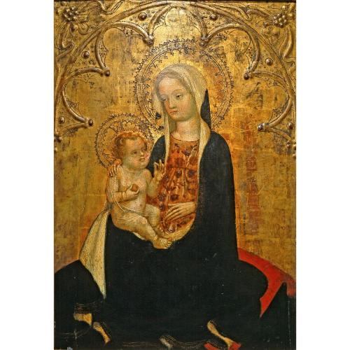 A woman holding a baby, set against a gold background  